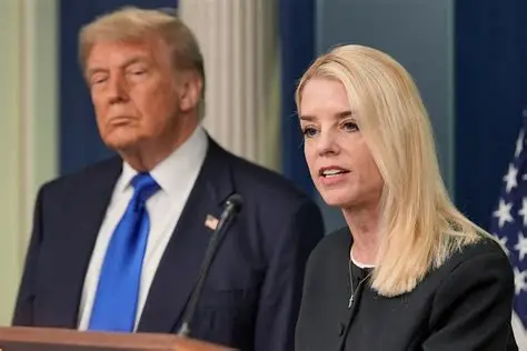 President Trump announces Attorney General Pam Bondi's removal during a White House press briefing, with Bondi visible in the background.