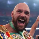 Tyson Fury celebrates victory over Arslanbek Makhmudov at Tottenham Hotspur Stadium as Netflix crowd roars during comeback fight.
