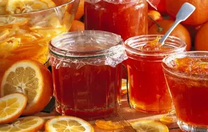 Jar of citrus marmalade with new labeling on UK supermarket shelf