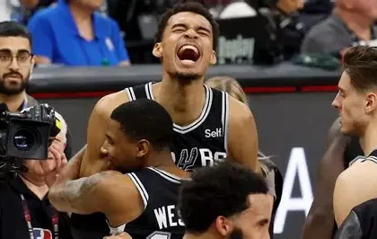 Victor Wembanyama celebrating NBA Defensive Player of the Year award