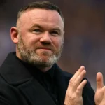 Wayne Rooney and Roy Hodgson during England match on touchline