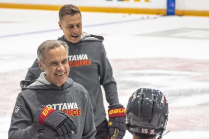 Mark Carney and Alexander Stubb play hockey
