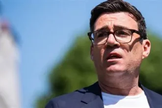 Andy Burnham appears alongside Keir Starmer during Ashton-under-Lyne visit April 2026