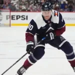 Charlie Coyle in a Columbus Blue Jackets jersey after signing a long-term contract extension.