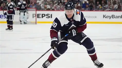 Charlie Coyle in a Columbus Blue Jackets jersey after signing a long-term contract extension.