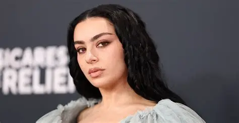 Charli XCX performing during rock-inspired music video for Rock Music single