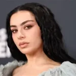 Charli XCX performing during rock-inspired music video for Rock Music single