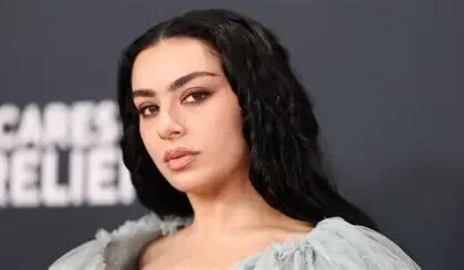 Charli XCX performing during rock-inspired music video for Rock Music single