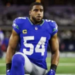 Bobby Wagner receives honorary doctorate on stage at Utah State University commencement.