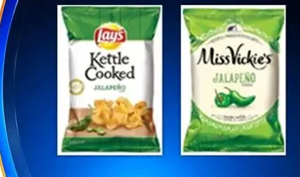 Bags of Zapp's and Dirty brand potato chips on a store shelf, subject to an FDA salmonella recall in 2026.