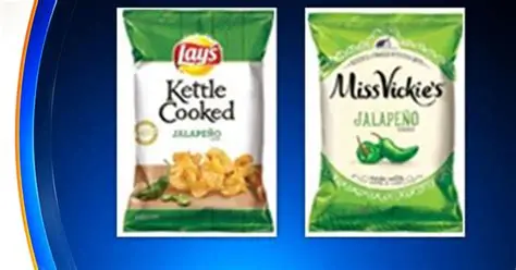 Bags of Zapp's and Dirty brand potato chips on a store shelf, subject to an FDA salmonella recall in 2026.