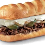 Medium Firehouse Subs Steak & Cheese Melt with prime rib, provolone, caramelized onions on top-cut roll.