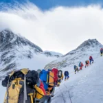 Long line 274 climbers scale Everest Nepal record death zone 8000m snowy slopes