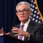 Federal Reserve Chair Jerome Powell speaks at a podium during his final days leading the U.S. central bank after eight years.