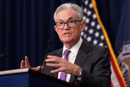 Federal Reserve Chair Jerome Powell speaks at a podium during his final days leading the U.S. central bank after eight years.