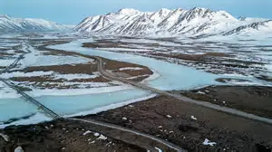 Alaska lawmakers debate trans-Alaska gas pipeline subsidy with project model on table.