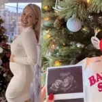 Karoline Leavitt holding her newborn daughter while smiling in a family photo shared online.