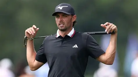 Marco Penge preparing swing on golf course — Marco Penge health break