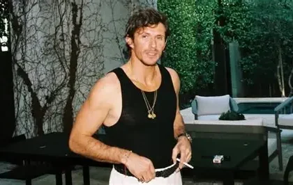 Jake Hall reality TV star posing at public event during fashion career