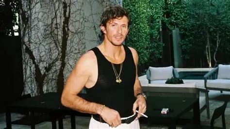 Jake Hall reality TV star posing at public event during fashion career
