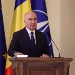 Romanian MPs vote to oust Prime Minister Ilie Bolojan in Parliament chamber during no-confidence motion.