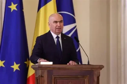 Romanian MPs vote to oust Prime Minister Ilie Bolojan in Parliament chamber during no-confidence motion.