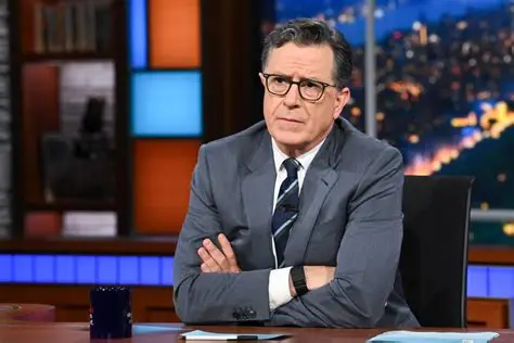 Stephen Colbert speaking during a late-night television interview while discussing the future of his show and CBS programming changes.