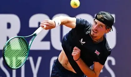 Toby Samuel celebrating his French Open qualification match victory.