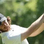 Tommy Fleetwood reacts after playing a shot during the second round of the Truist Championship at Quail Hollow.
