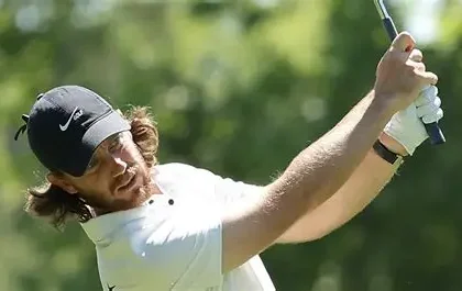 Tommy Fleetwood reacts after playing a shot during the second round of the Truist Championship at Quail Hollow.