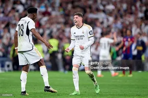 Valverde Tchouameni fight — Real Madrid players Federico Valverde and Aurélien Tchouameni on the pitch during a La Liga match, wearing Real Madrid's white home kit.