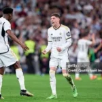 Valverde Tchouameni fight — Real Madrid players Federico Valverde and Aurélien Tchouameni on the pitch during a La Liga match, wearing Real Madrid's white home kit.