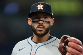Houston Astros Carlos Correa on crutches with ankle boot after tendon tear injury.