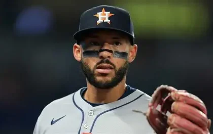 Houston Astros Carlos Correa on crutches with ankle boot after tendon tear injury.