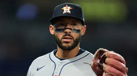 Houston Astros Carlos Correa on crutches with ankle boot after tendon tear injury.