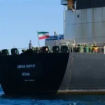 Iranian forces board the seized Ocean Koi tanker in the Gulf of Oman amid US-Iran naval clash.