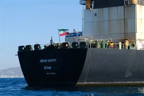 Iranian forces board the seized Ocean Koi tanker in the Gulf of Oman amid US-Iran naval clash.