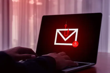 Phishing scams warning signs displayed on a laptop and smartphone screen