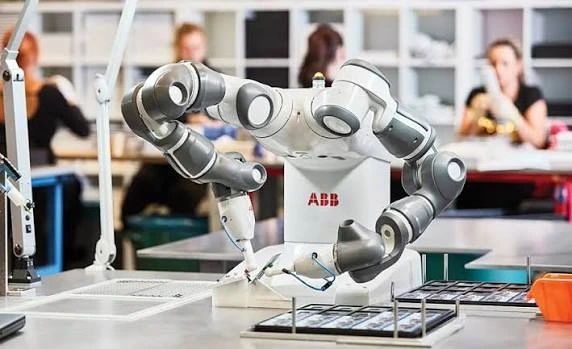 Collaborative robots working safely alongside human workers in a modern manufacturing facility