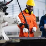 Robotics and jobs explained with robots working alongside human workers in an automated workplace