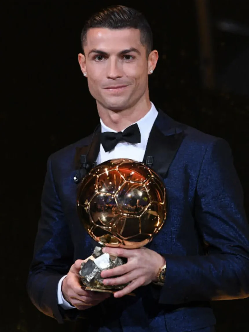 Cristiano Ronaldo Ballon d'Or winner celebrating with one of his five awards
