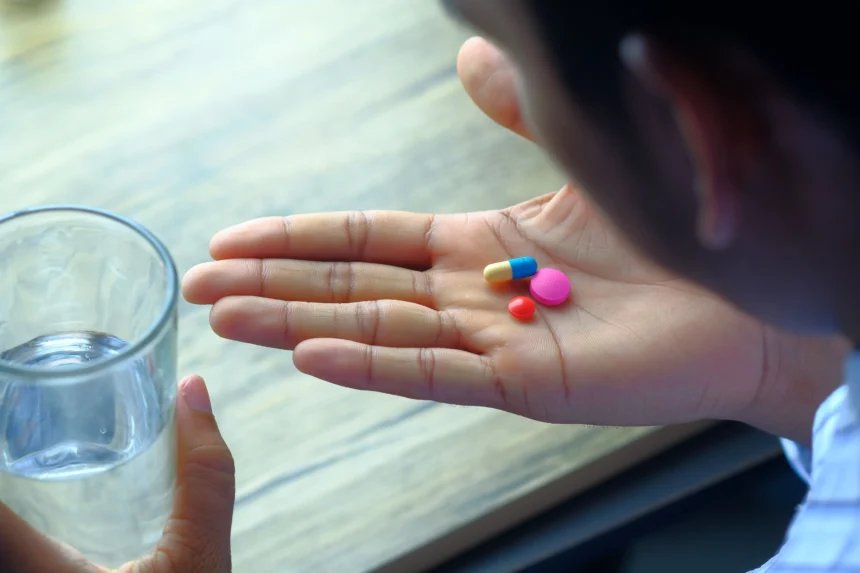 Why patients need to take medicine with food for absorption and stomach protection
